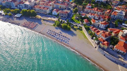 an aerial view of a beach with tables and chairs at Nafpaktos studio in port Ι in Nafpaktos