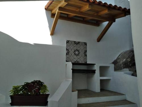 a staircase in a house with a wooden ceiling at Manzanillo Private Plunge Pool Ocean Views in Manzanillo