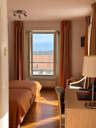 Postel nebo postele na pokoji v ubytování Auberge Aux Deux Sapins