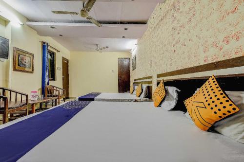 a large bed in a room with two beds at Spot On Swagat Palace in New Delhi