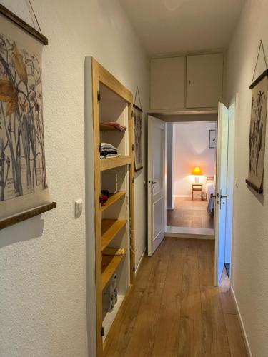 a hallway with a room with a door and a room with a table at „Altes Forsthaus“ am Schloss in Uelzen