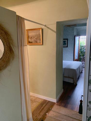 a room with a bed and a bedroom with a window at Patios del Agua in El Puerto de Santa María