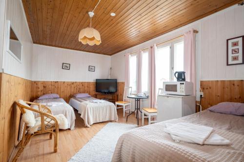 Postel nebo postele na pokoji v ubytování Arctic Guesthouse & Igloos
