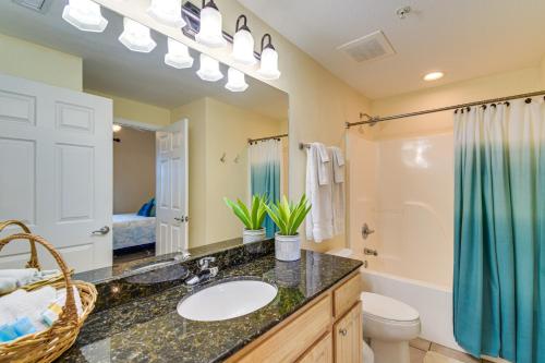 a bathroom with a sink and a toilet and a shower at PoolandBeach-View Gulf Shores Condo Family Friendly in Gulf Shores