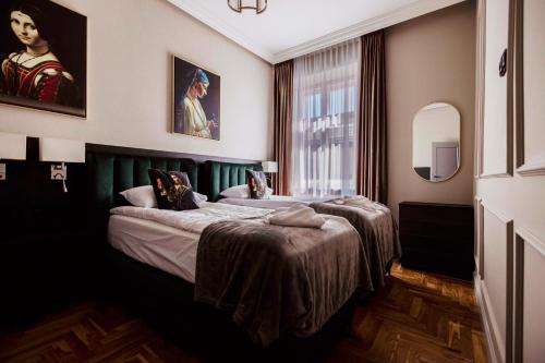 a bedroom with two beds and a large window at Crown Pearl - wonderful apartment, 110scm, 4 rooms in Kraków