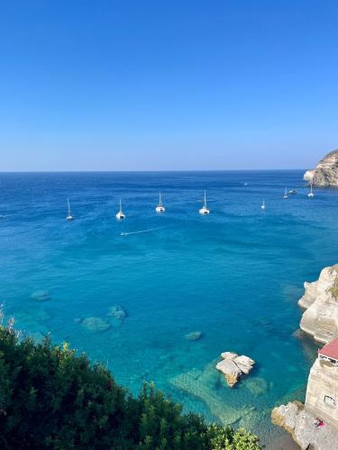 a view of the ocean with boats in the water at Hotel Villa Maria in Ischia