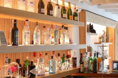 a bar filled with lots of bottles of wine at Ibiscus Boutique in Mýkonos City