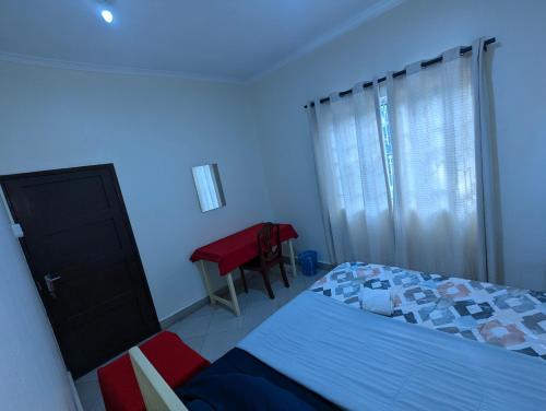 Кровать или кровати в номере JACARANDA HOMESTAY