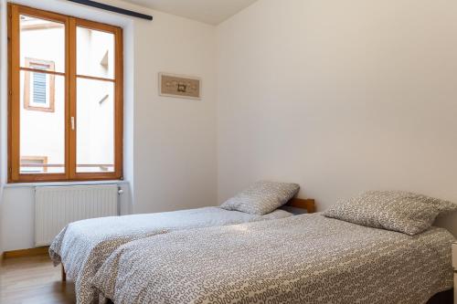 Cama o camas de una habitación en Gite hyper centre 10 pers