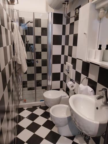 a bathroom with a sink and a toilet and a shower at IL FARO - garage mt 4,75 - beach mt 150 - 09001-LT-1414 in Alassio
