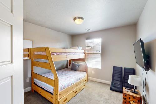 a bedroom with two bunk beds and a flat screen tv at Great Escape in Washington