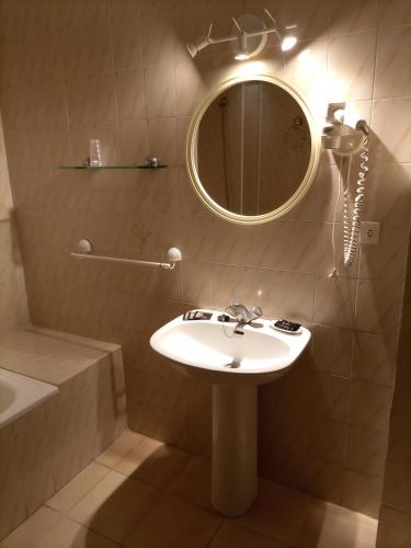 a bathroom with a sink and a mirror at Vintage Hotel Mercedes in Lloret de Mar