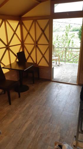 a room with a table with a laptop on it at Luiza Guest House in Areni