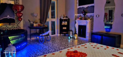 a living room with a bed and a fireplace at Anzio d'aMare in Anzio