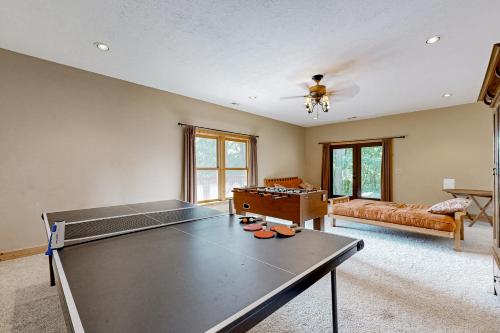 a living room with a ping pong table at The Glen of Iron Duff in Waynesville