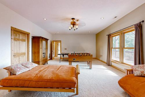a bedroom with a bed and a pool table at The Glen of Iron Duff in Waynesville