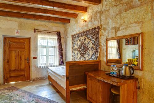 Postel nebo postele na pokoji v ubytování Avilla Cave Hotel