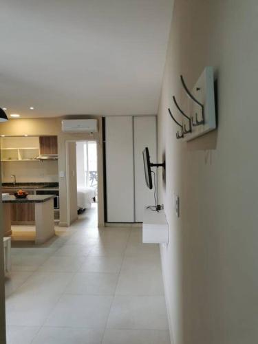 a kitchen and a living room with a white floor at CoWorking in Corrientes