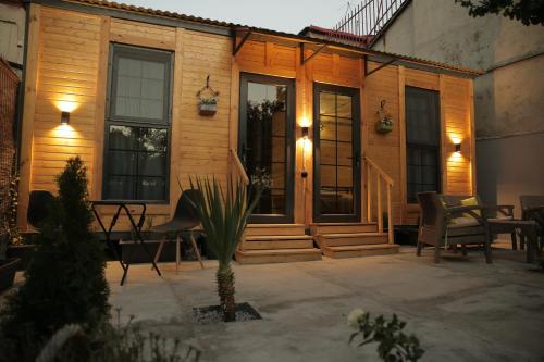 a house with a porch with a table and chairs at Dream House in Yerevan
