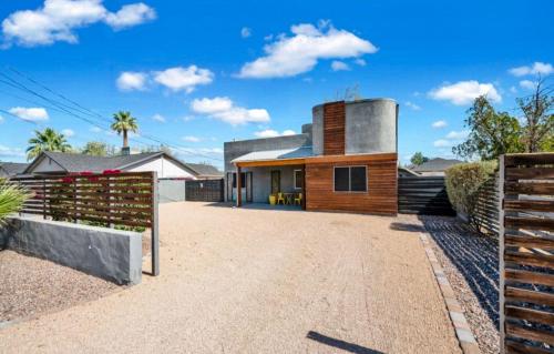 a house in the middle of a dirt road at Modern Art House in Midtown, Pet Friendly in Phoenix