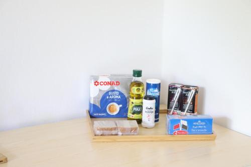 a shelf with alcohol and other products on a table at Family Luxurious Beach Penthouse in Trou dʼ Eau Douce