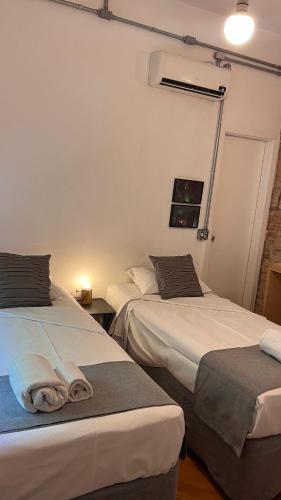 Guest Urban Hotel Design Pinheirosにあるベッド