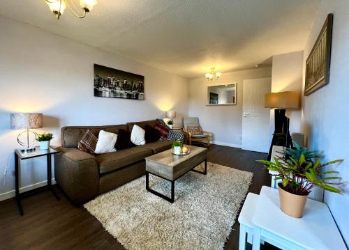a living room with a couch and a table at Cityview Retreat - 2-Bed Apartment - Free Parking in Glasgow