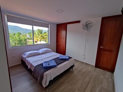Postel nebo postele na pokoji v ubytování Hotel Resort Campestre Puerta Del Sol - San Gil