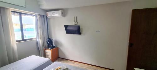 Televisyen dan/atau pusat hiburan di Flat Pasárgada 812, pé na praia