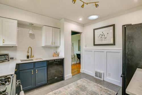 a kitchen with blue cabinets and a sink at St Louis Home Less Than 1 Mi to Forest Park! in Benton