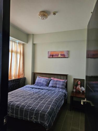 Postel nebo postele na pokoji v ubytování BORACAY CONDOMINIUM NEWCOAST OCEANWAY Residences B, UNIT GFF