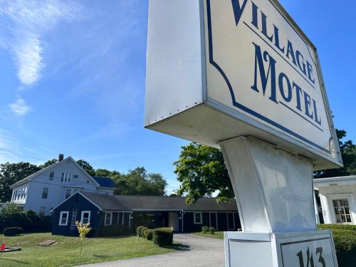 a street sign in front of a house at Village Motel in Clinton