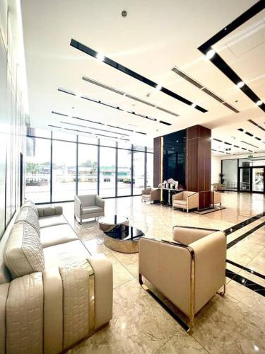 a large lobby with couches and chairs in a building at More Than Home - Căn hộ ấm áp, gần gũi, hiện đại! in Hạ Lý