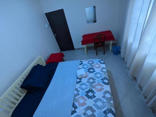 Кровать или кровати в номере JACARANDA HOMESTAY