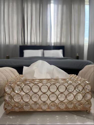 a box sitting on a table in a living room at Corniche Street - Extremely Unique Room in Abu Dhabi