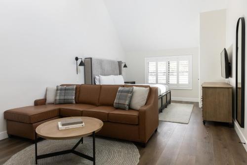 a living room with a couch and a bed at Homestead Resort in Midway