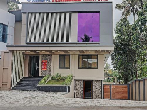 a rendering of a house with purple windows at Super Townhouse Kizhakkambalam Tourist Home in Cochin