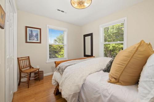 a bedroom with a bed and a clock on the wall at Chase House at Low-Key Croft - Hot-tub - Firepit in West Fork