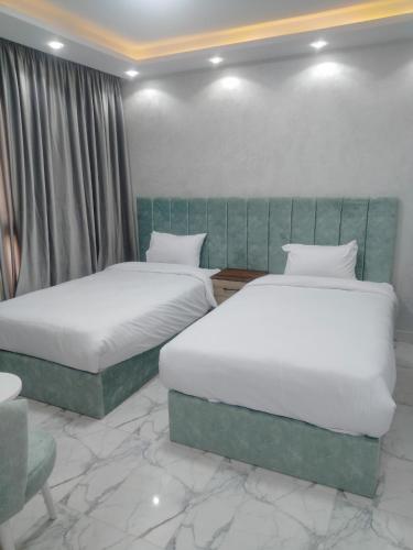 Кровать или кровати в номере Porto Said Apartment powered By Amer-Group family only