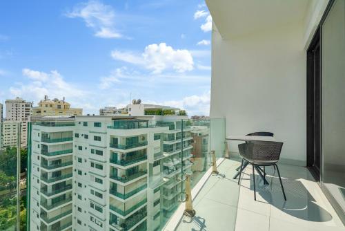 a balcony with a view of a tall building at Monaco Residences Piantini in Santo Domingo