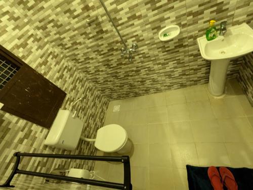 Ванная комната в JACARANDA HOMESTAY