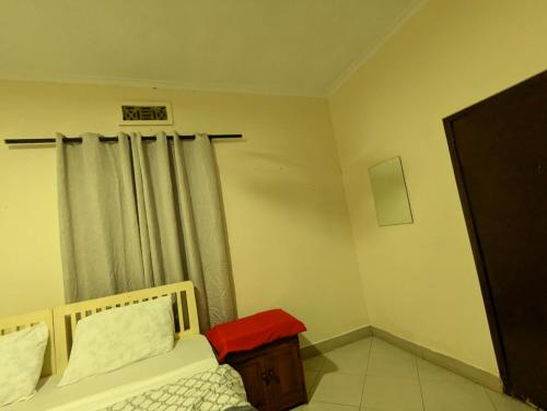 Кровать или кровати в номере JACARANDA HOMESTAY