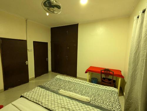 Кровать или кровати в номере JACARANDA HOMESTAY