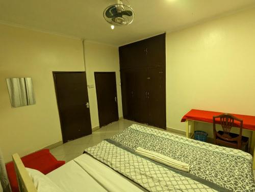 Кровать или кровати в номере JACARANDA HOMESTAY
