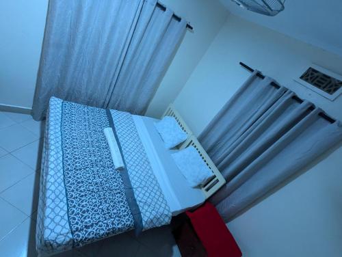 Кровать или кровати в номере JACARANDA HOMESTAY