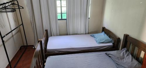 Ένα ή περισσότερα κρεβάτια σε δωμάτιο στο Casa e Conforto