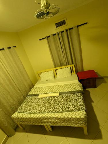 Кровать или кровати в номере JACARANDA HOMESTAY