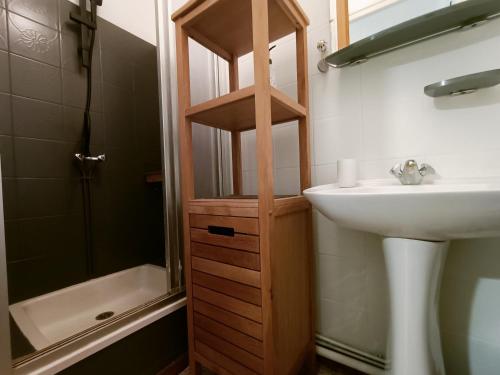 a bathroom with a sink and a toilet and a shower at Clos de Bigorre in Tabanac