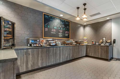 a fast food restaurant with a chalkboard on the wall at Hotel Peppertree Bend, BW Premier Collection in Bend