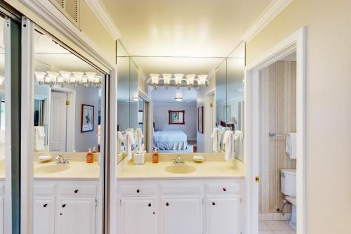 a bathroom with two sinks and a large mirror at Silverado Resort and Spa 271 & 272 in Napa